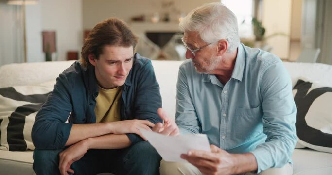 Homework, senior man and teaching college student on sofa with exam and learning. Thinking, reading and grandfather support with paperwork for university, education and school test advice with study