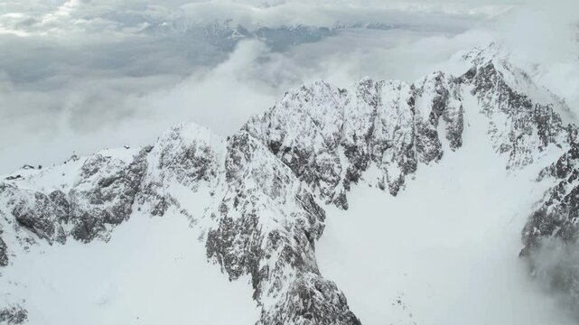 Aerial View of Nordkette Ridgeline of Austrian Alps Above Innsbruck Ski Resort in Winter Season