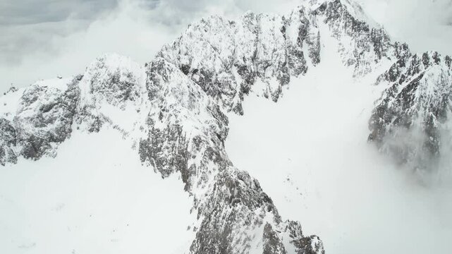 Aerial View of Snow Capped Peals of Austrian Alps Above Innsbruck Ski Resort, Drone Shot
