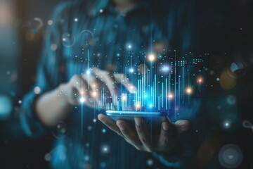 businessman holding phone on hand with hologram stock data graph background