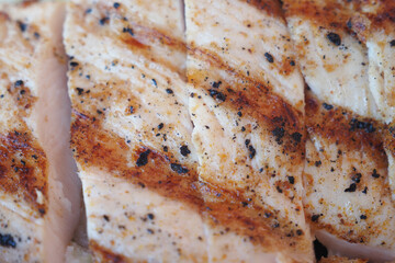 Perfectly seasoned grilled chicken breast, ideal for barbecue or a delicious meal