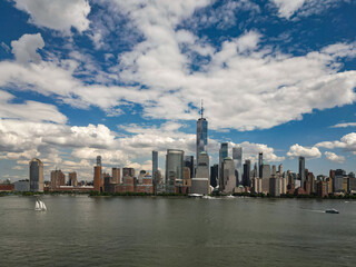 Obraz premium New York City top view. NYC aerial view, New York City Skyline with dramatic sky. Panoramic drone view on Manhattan in NY. Night in NYC. New York City Midtown skyline view at dusk with clouds.