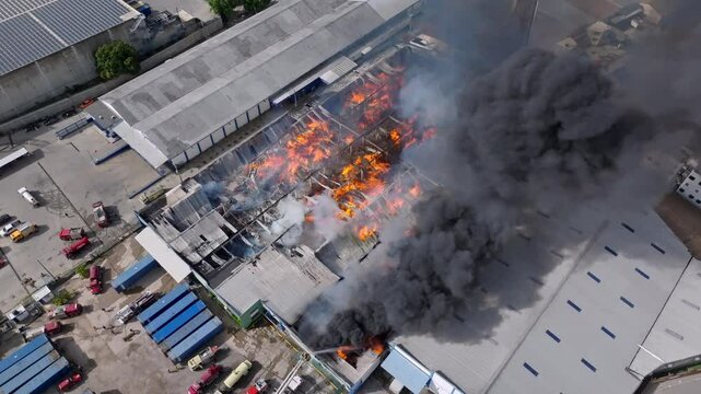 Top orbit shot of a devastating fire in a warehouse in the city of Santo Domingo, Dominican Republic