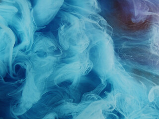 Twisted steam. Colorful smoke cloud. Glitter blue purple mist ink on sparkling gold background creative hypnotic abstract shimmering art.