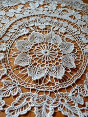 White Lace Doily on Wooden Table.