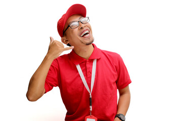 Asian delivery man or courier stands confidently against a white background, making a playful 'call...