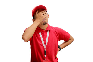 An annoyed Asian delivery man or courier is facepalming, hiding his face in frustration and...