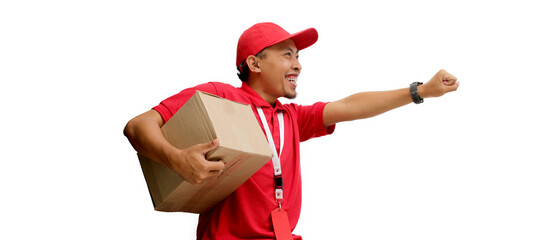 Excited Asian delivery man or courier strikes a flying pose while holding a cardboard box, ready for delivery, isolated on a white background. Concepts of speedy delivery, and express shipping