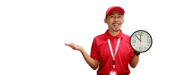 Excited Asian delivery man or courier confidently presents empty copy space to the camera while holding a clock in his hand, isolated on a white background.