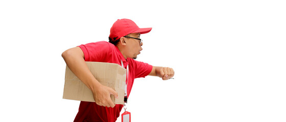 Asian delivery man or courier in a running pose, carrying a cardboard box package parcel in a hurry, isolated on a white background