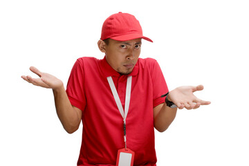 Asian delivery man or courier shrugging his shoulders in an 'I don't know' gesture, appearing clueless and uncertain, isolated on a white background