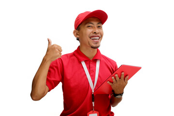 Happy Asian Delivery man or courier is confidently showing a thumbs-up gesture while holding a tablet, symbolizing approval or success in delivery services, Isolated on a white background