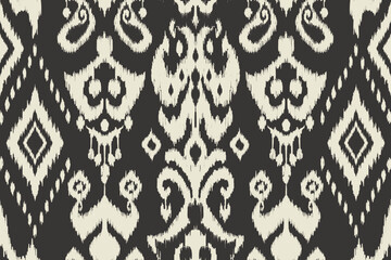 Ikat paisley embroidery on the fabric in Indonesia,India and asian countries.geometric ethnic oriental seamless pattern.Aztec style. illustration.design for texture,fabric,clothing,wrapping,carpet