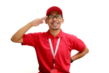 Excited Indonesian delivery man or courier celebrating Indonesian Independence Day by making a salute gesture. Isolated on a white background