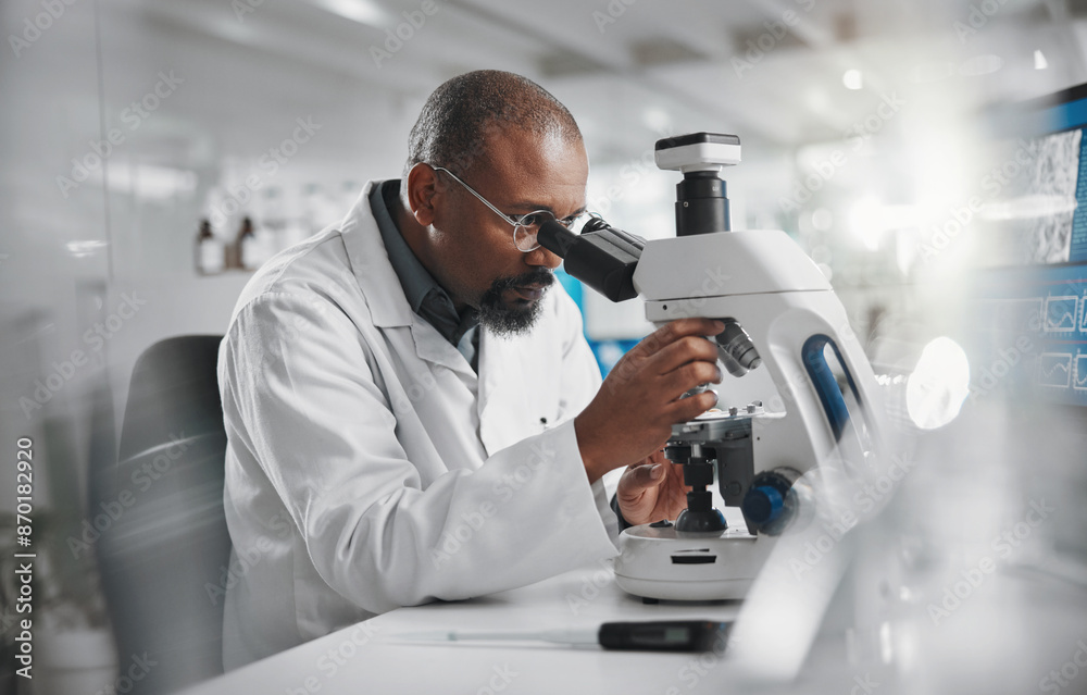 Wall mural Scientist, development and microscope in laboratory for analysis, innovation and medical research. Black man, technology and professional person or expert in clinic for diagnosis, cure or health care