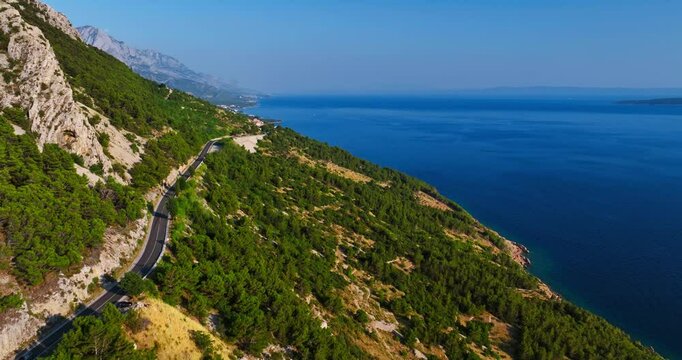 Aerial view following a mountain road on the Makarska riviera in sunny Croatia