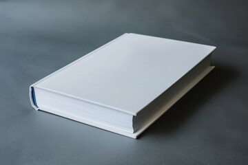 Fototapeta premium Minimalist Hardcover Book Mockup on Dark Gray Surface for Cover Design
