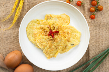 Breakfast. Omelette in Indonesia it is called telor dadar. overhead flat lay shot