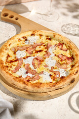 Delicious Bacon Pizza with Creamy Sauce in Sunlit Summer Setting