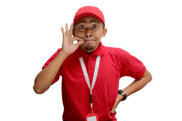 Asian delivery man is gesturing for silence by mimicking a zipped mouth, indicating a promise to...