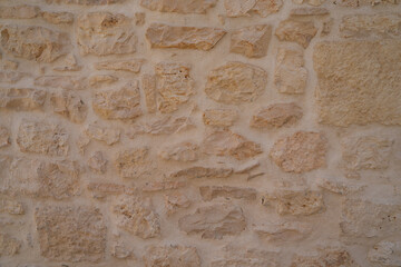 Medieval stone wall texture in Puglia Italy