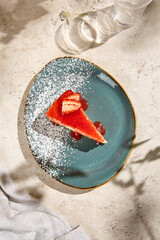 Strawberry New York Cheesecake Slice in Sunlight on Beige Table - Textured Natural Aesthetic Still Life
