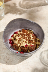 Authentic Chocolate Sour Cream and Caramel Sponge Cake on a Beige Rustic Table in Sunlit Still Life