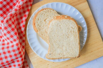 Two Slices bread in white plate for breakfast