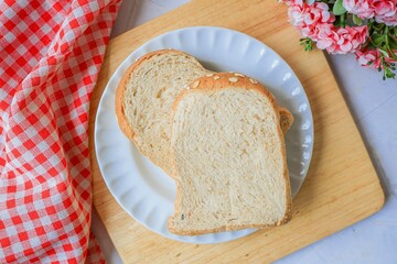 Two Slices bread in white plate for breakfast	
