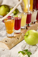 Fresh Fruit and Berry Infusions in Sunlit Rustic Setting - Refreshing Summer Beverages with Apples and Berries