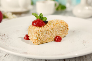 Napoleon Pastry with Berry Sauce on Sunny Wooden Table - Captivating Food Photography