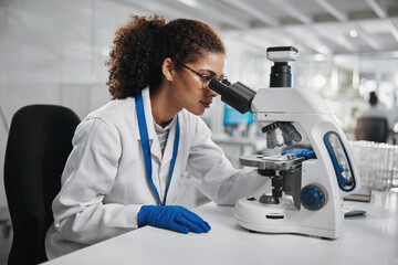 Microscope, woman check and virus research of science study with healthcare, scientist and...