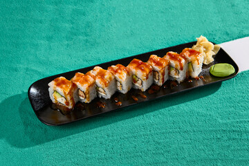 Shrimp Avocado Roll with Unagi Sauce - Delicious Sushi on Black Plate