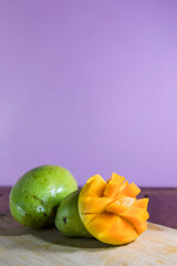 Mango Harumanis slice on wooden table background.