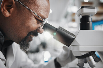 Black man, scientist and microscope in laboratory for analysis, innovation and medical research....