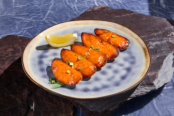 Baked Mussels with Cheese and Lemon on a Rustic Plate - Gourmet Seafood Cuisine Stock Photo