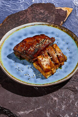BBQ Pork Ribs with Eggplant on Blue Plate – Gourmet Food Photography