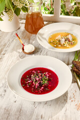 Summer Soup Composition Okroshka and Beetroot Soup in Sunlit Wooden Setting
