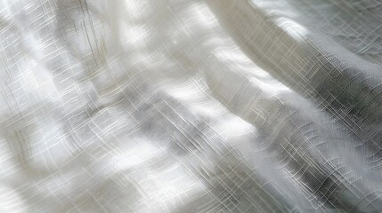 A white fabric with a pattern of lines and shadows