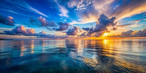 beautiful evening sunset, blue sea, vibrant colors, sun setting over the horizon