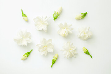 Group jasmine flower on white paper background , top view , flat lay.