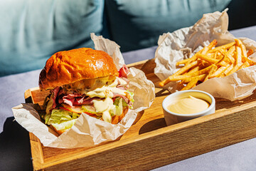 burger with french fries and sauce