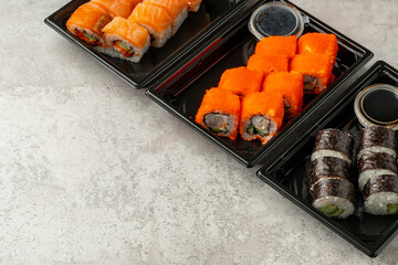 Close up of sushi rolls on gray table