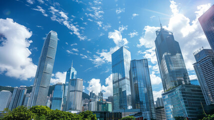 Stunning city view with skyscrapers reaching towards a clear blue sky. The modern buildings and glittering skyline make for a captivating backdrop.