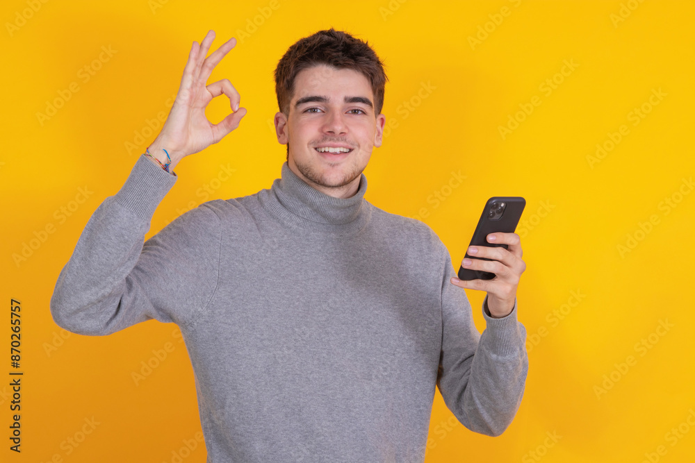 Poster isolated young man with mobile phone