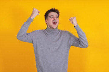 teenager celebrating isolated on background