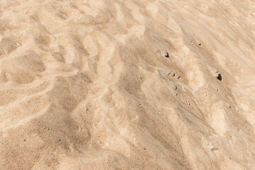 Sandy dune surface, natural background photo with selective soft focus