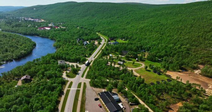 Drone tracking a truck driving through the Utsjoki village, summer in Finland