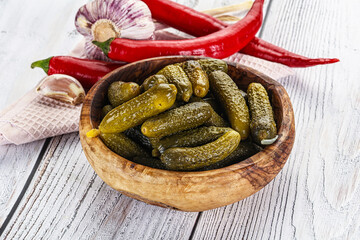 Marinated small cucumbers in the bowl