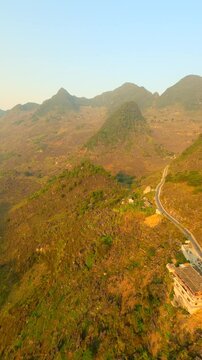 Picturesque mountain landscape on the Ha Giang loop route at sunset, Vietnam